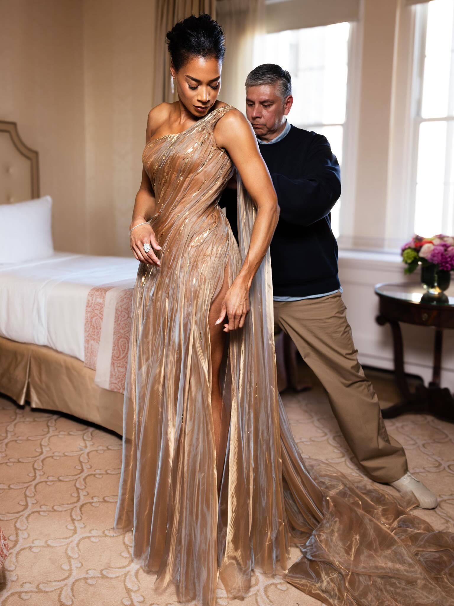 Aisha McShaw getting dressed, gown fitting