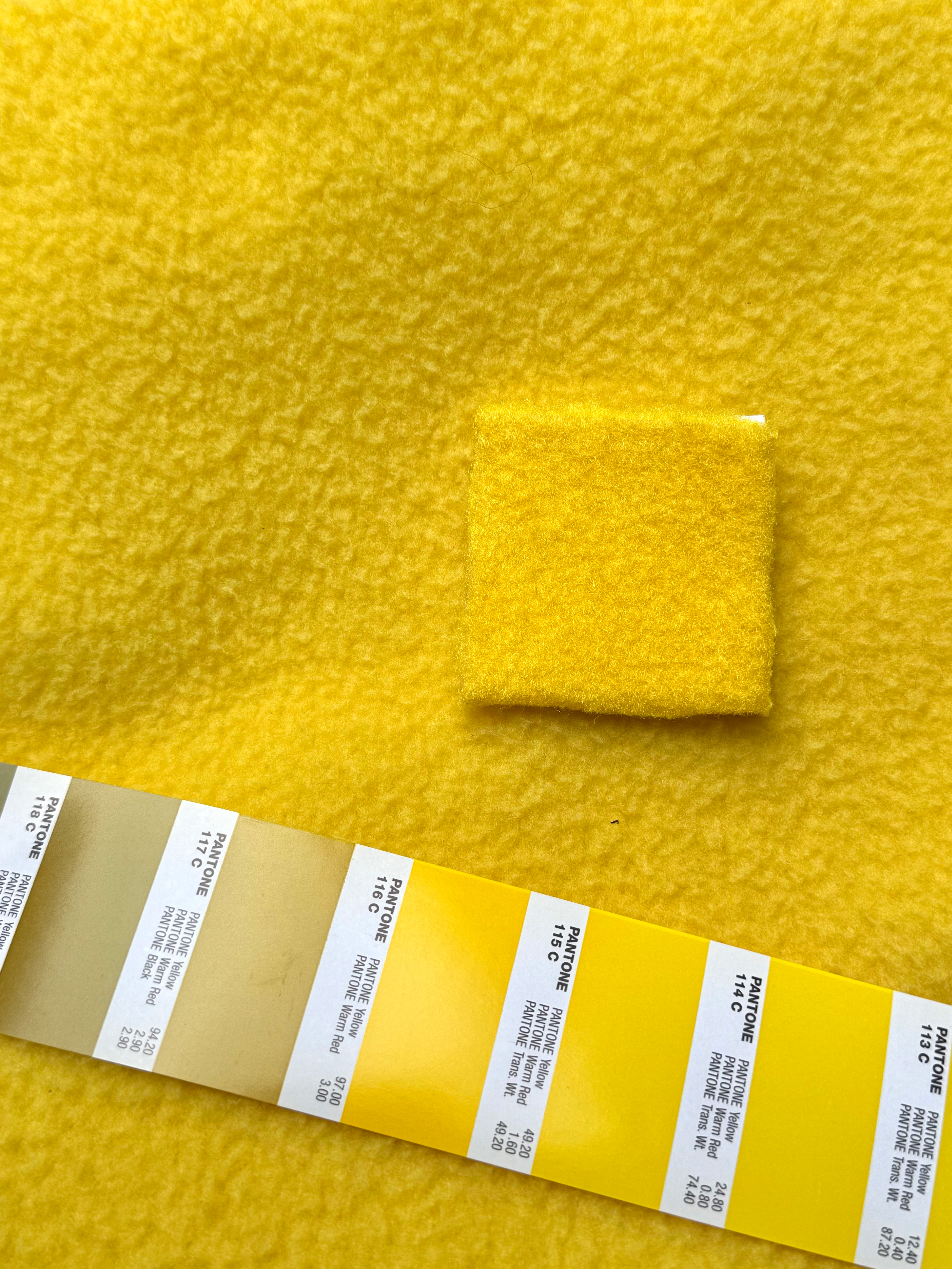 Custom dyed yellow puppet fleece with Pantone swatch